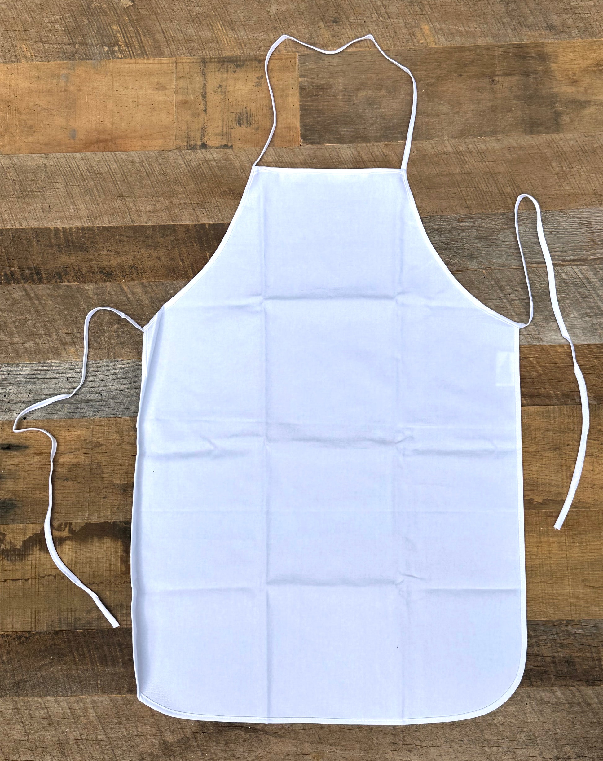 White apron on a wooden surface