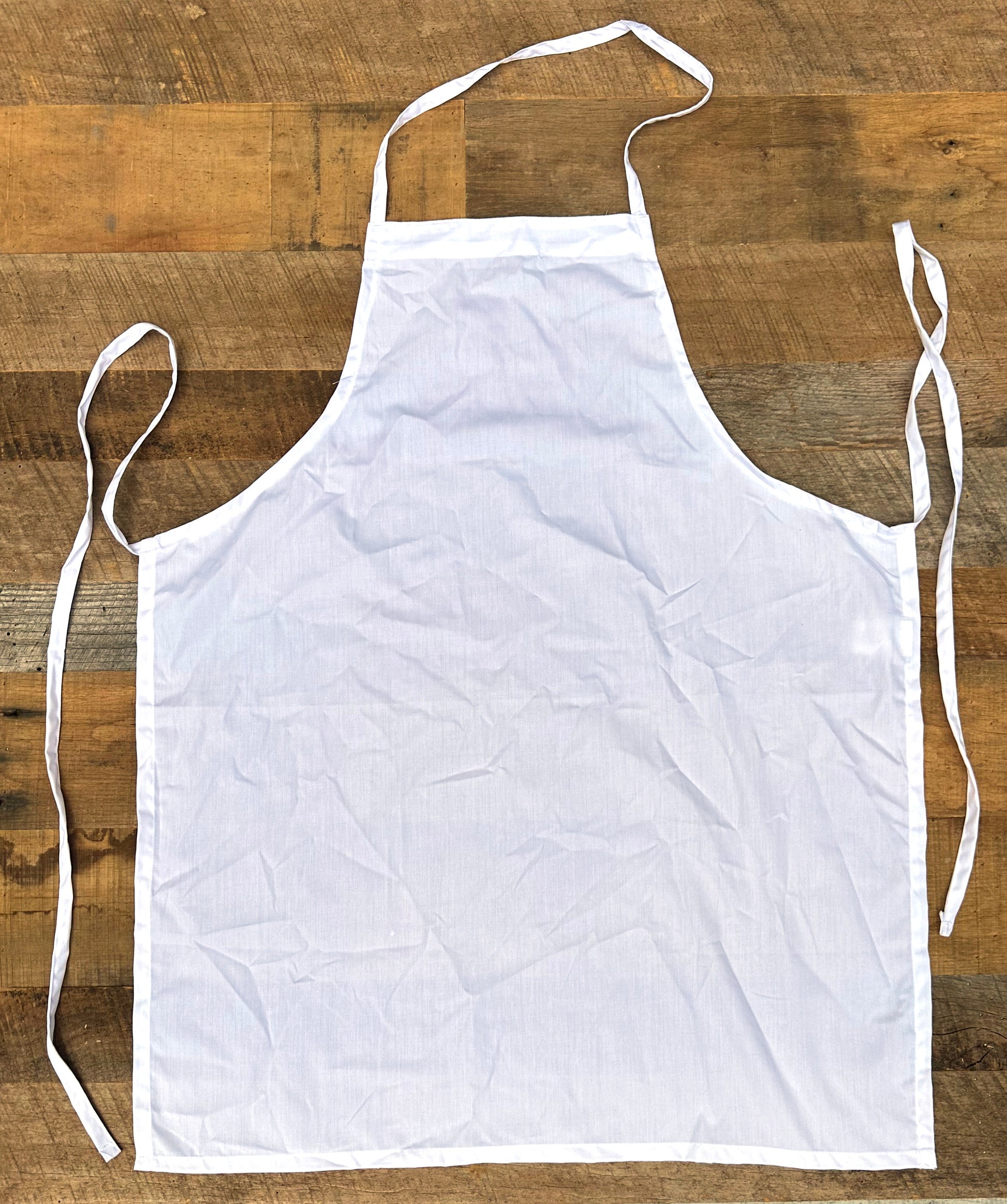 White apron on a wooden surface