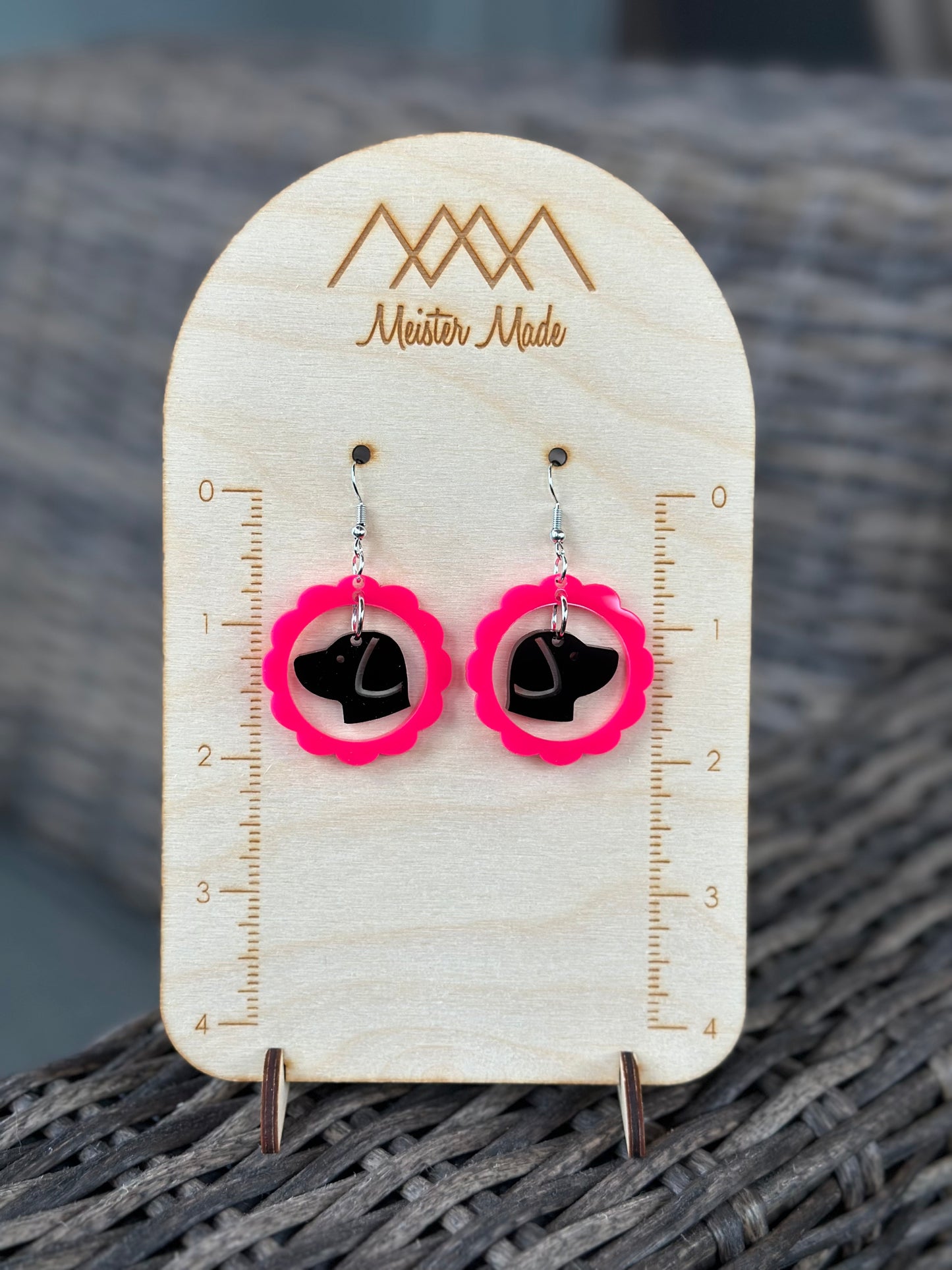 hot pink frame with a black dog earrings