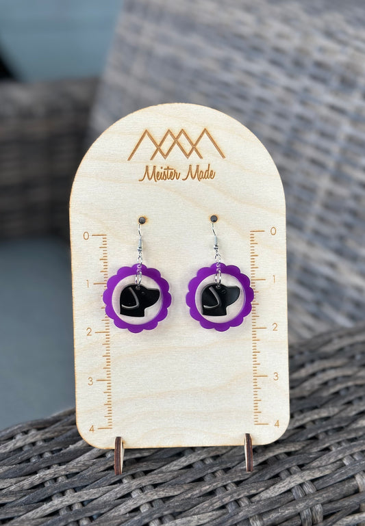 purple frame with a black dog earrings