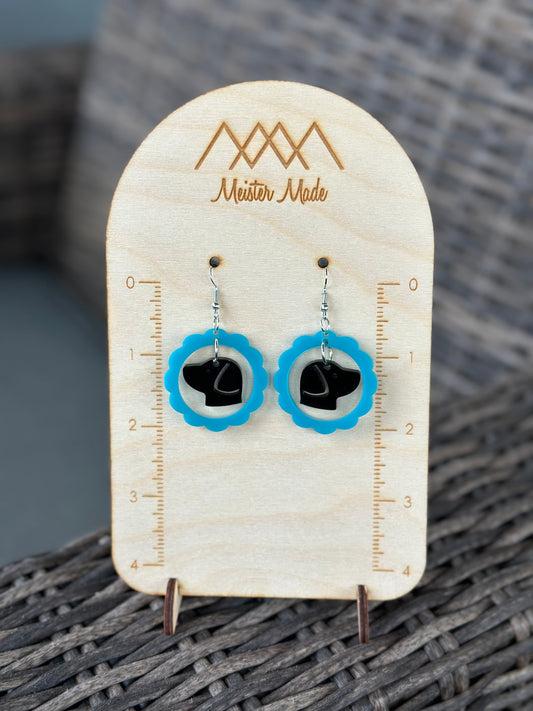 teal frame with a black dog earrings