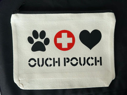 canvas pouch with black paw print, red cross, black heart, and 'OUCH POUCH' text on a black background.