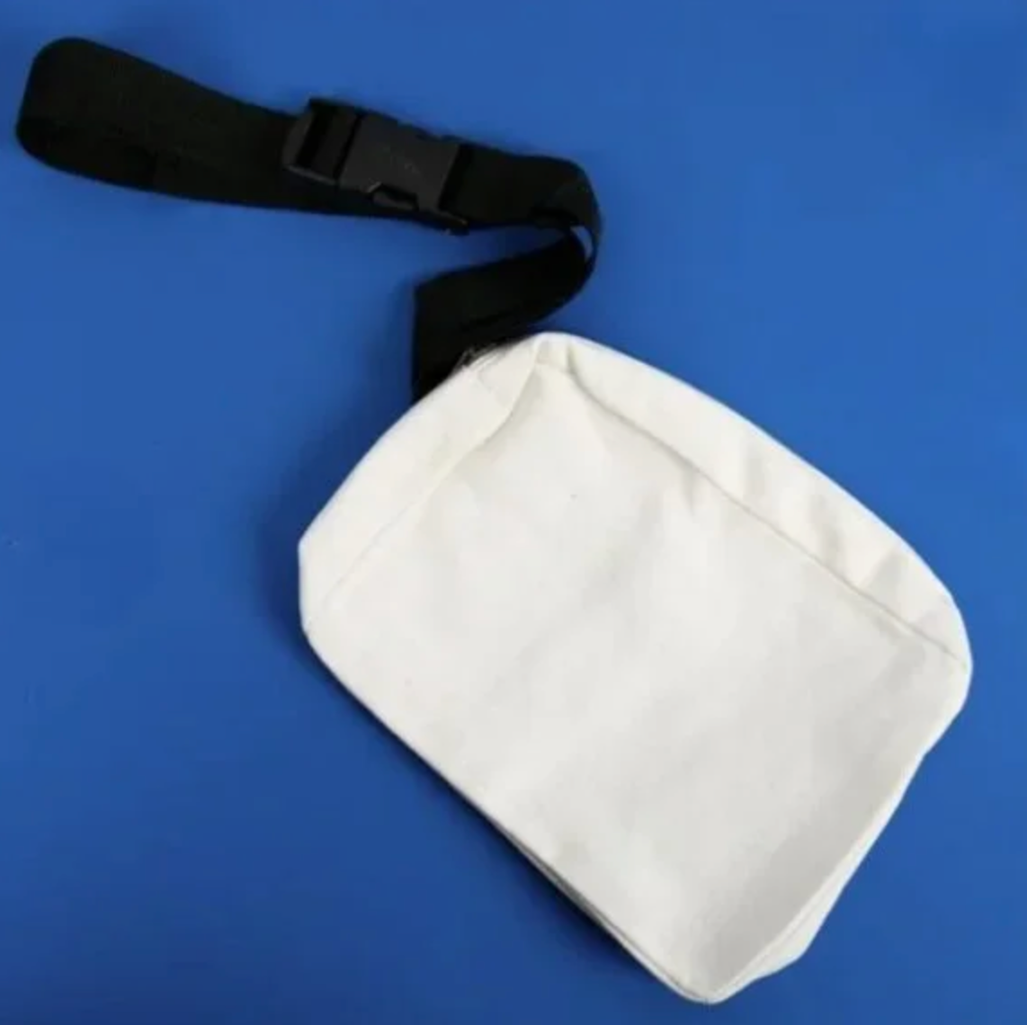 White waist bag with a black strap on a blue background