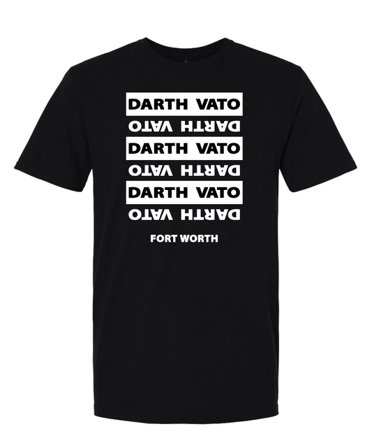A black short-sleeve crewneck t-shirt featuring a white graphic print on the front with the text 'DARTH VATO' repeated five times in stacked white rectangles, with 'FORT WORTH' printed below in white.